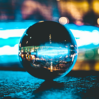 Close-up of a marble on concrete pavement. Photo by Joshua Fuller on Unsplash