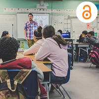 Students in a classroom and teacher speaking to them. Photo by Kenny Eliason on Unsplash