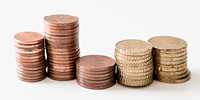 Five stacks of coins of different sizes. Photo by Ibrahim Rifath on Unsplash