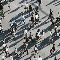  Aerial view of people walking on raod. Photo by Ryoji Iwata on Unsplash