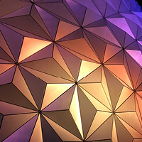 A close up of metallic dome with colors shifting from gold to purple. Photo by Stephen Johnson on Unsplash